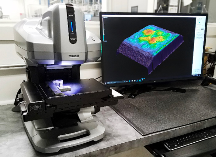 Keyence VR-3200 Wide-Area 3D Measurement System scanning the topography of a surface on a computer monitor.