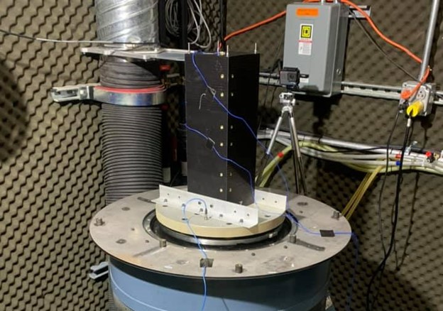 black Serenity 3u Orbital Satellite on blue and gray G-Force simulator in ITS lab